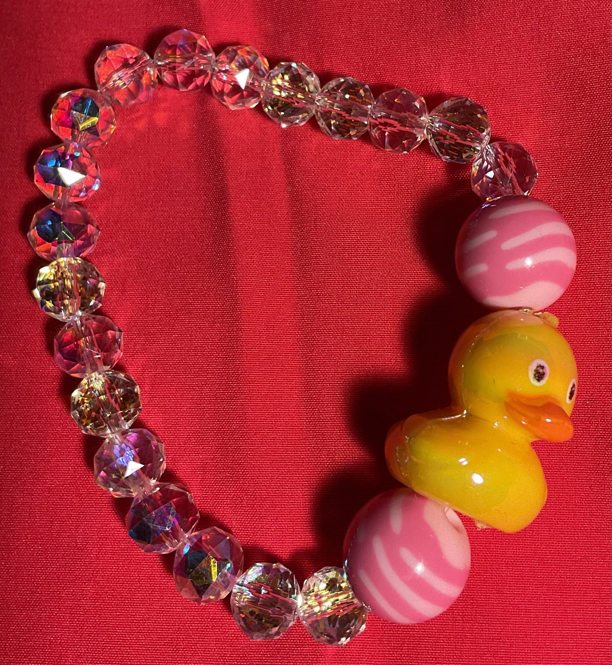 Yellow Duckie with clear accents bracelet on 7 inch elastic thread. Adjustable.