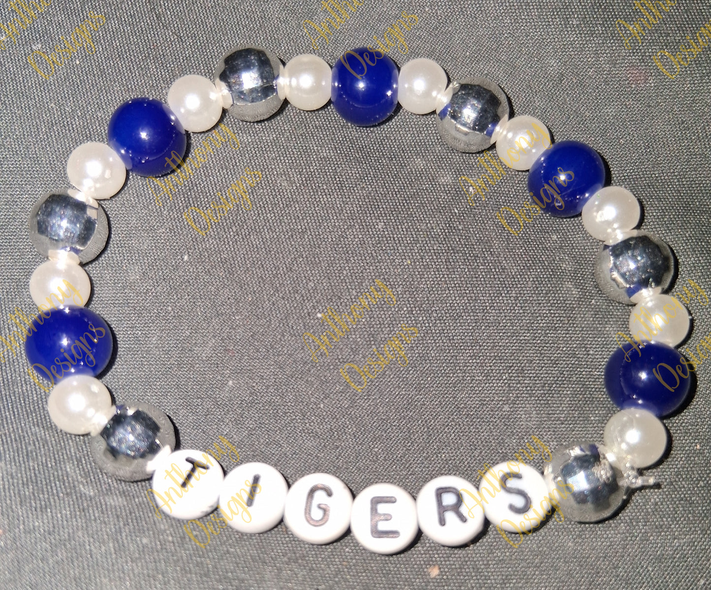 Tigers royal blue white disco ball bracelet on 7 inch elastic thread. Adjustable.