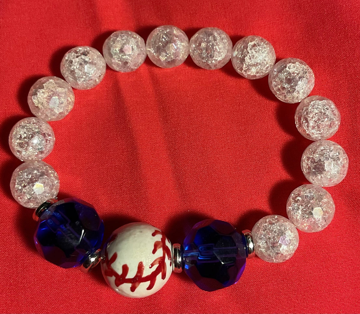 Baseball with Royal blue and clear accents bracelet on 7 inch elastic thread. Adjustable.