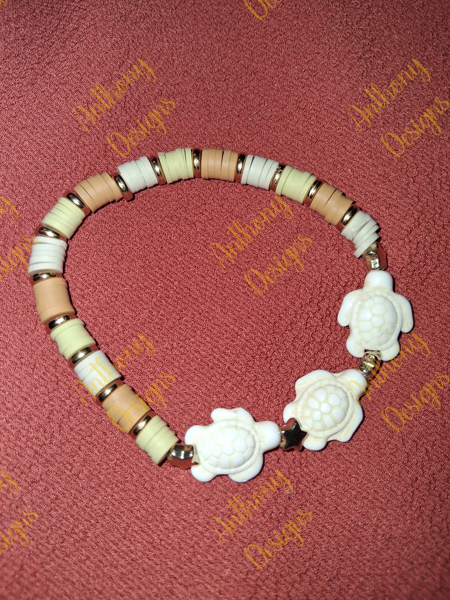 Turtle beads with tans and green accents bracelet on 7 inch elastic thread. Adjustable.
