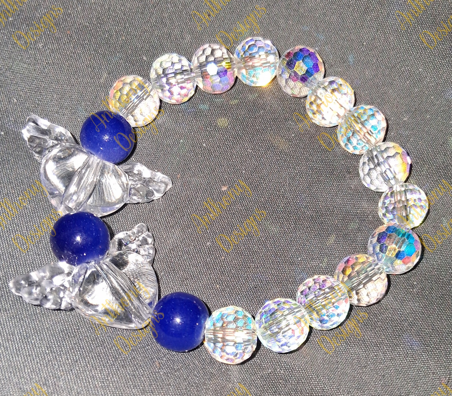 Clear Hearts with wings  royal blue  bracelet on 7 inch elastic thread. Adjustable.