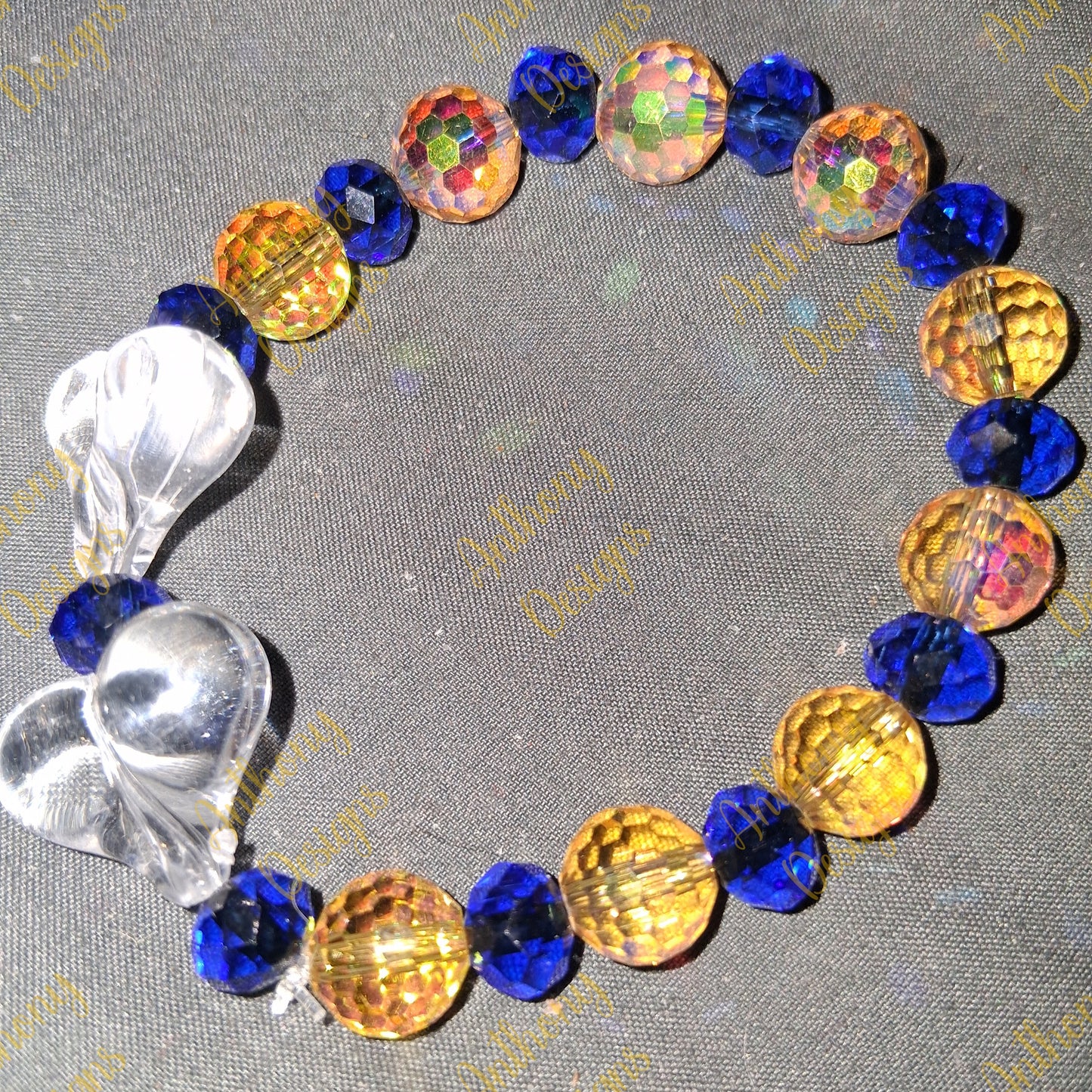 Clear Hearts  royal blue and gold  bracelet on 7 inch elastic thread. Adjustable.