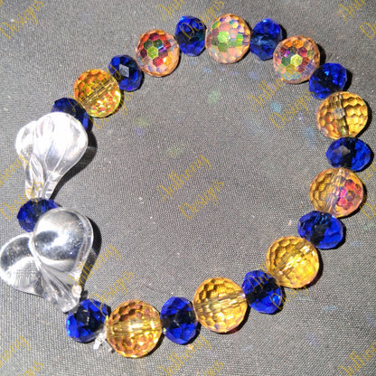Clear Hearts  royal blue and gold  bracelet on 7 inch elastic thread. Adjustable.